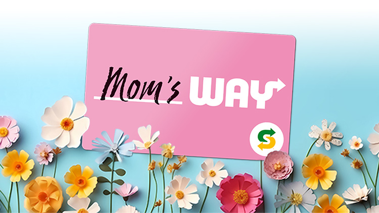 Mother’s Day gift card and flowers on blue backdrop 